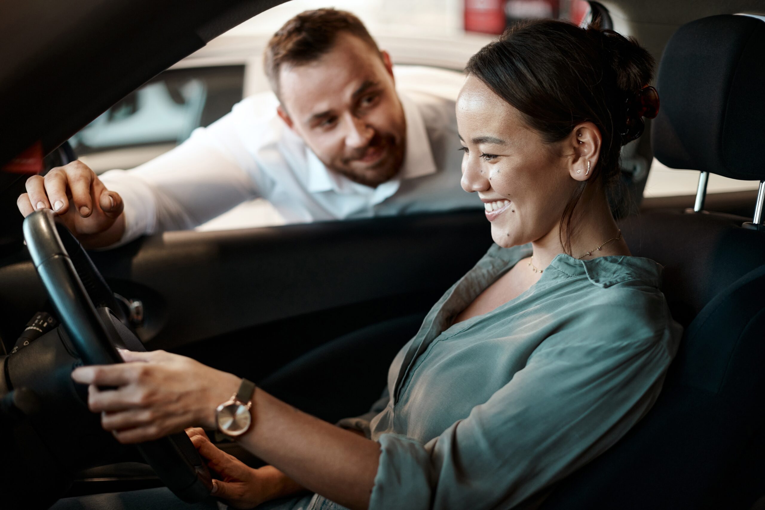 Salesman,,Woman,And,Purchase,A,New,Car,At,Dealership,With